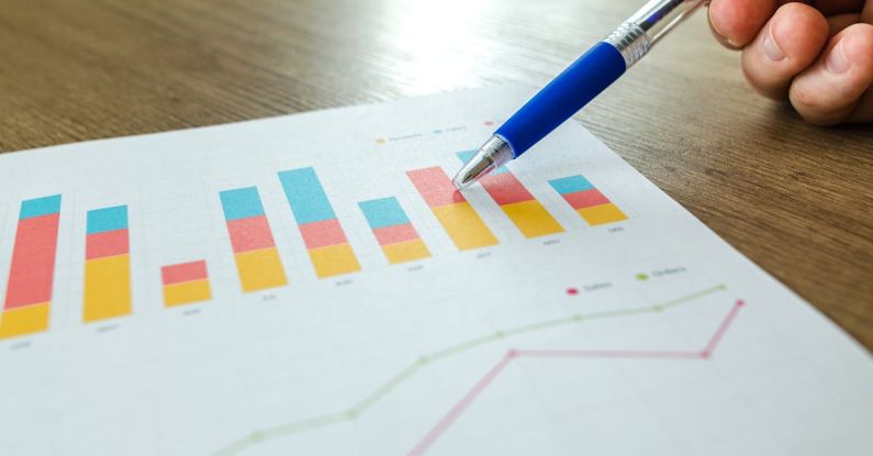 Case Study - Person Holding Pen Pointing at Graph