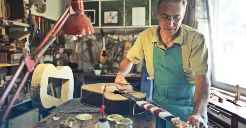 Decision-Making Tools - Photo of Man Making an Acoustic Guitar