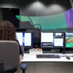 Monte Carlo Simulation - Female Engineer Controlling Flight Simulator