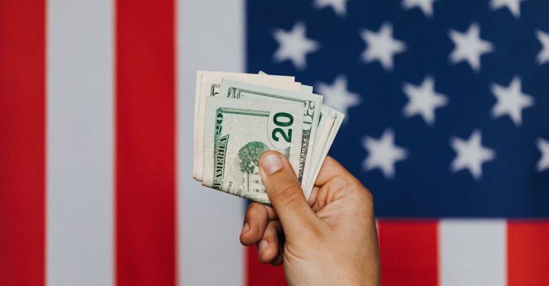 Pareto Principle - Unrecognizable male demonstrating dollars before official flag of USA on background