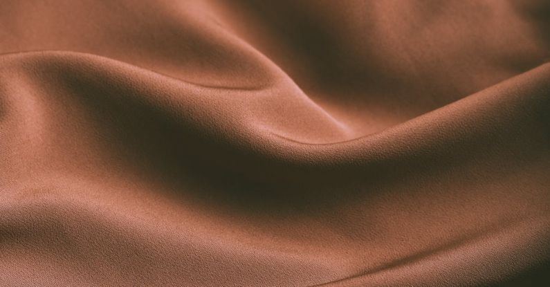 Hawthorne Effect - From above of elegant brown draped silk fabric with smooth texture as abstract background