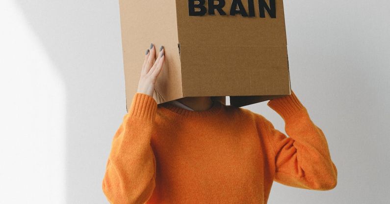 Capacity Planning - Crop person putting Idea title in cardboard box with Brain inscription on head of female on light background