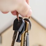 Key Ratios - Person with keys for real estate