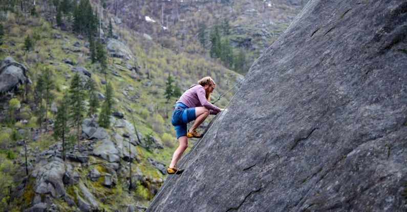 Risks - Man Climbing on Rock Mountain