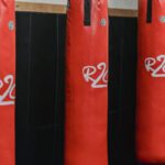 Supply Chain Risk - Interior of boxing gym with heavy punching bags hanging on chains for workout