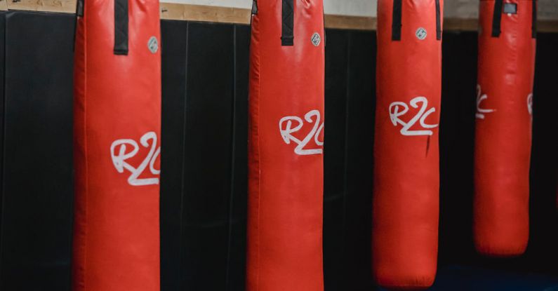 Supply Chain Risk - Interior of boxing gym with heavy punching bags hanging on chains for workout