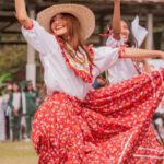 Organizational Culture - Smiling Woman Dancing in Traditional Dress