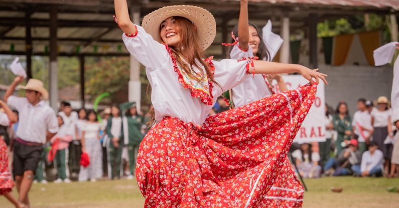 Organizational Culture - Smiling Woman Dancing in Traditional Dress