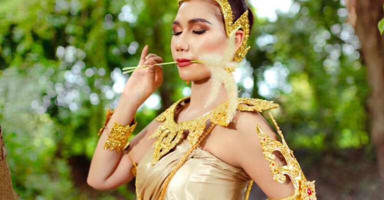 Organizational Culture - Woman in a Traditional Costume with Golden Jewelry Posing in a Park