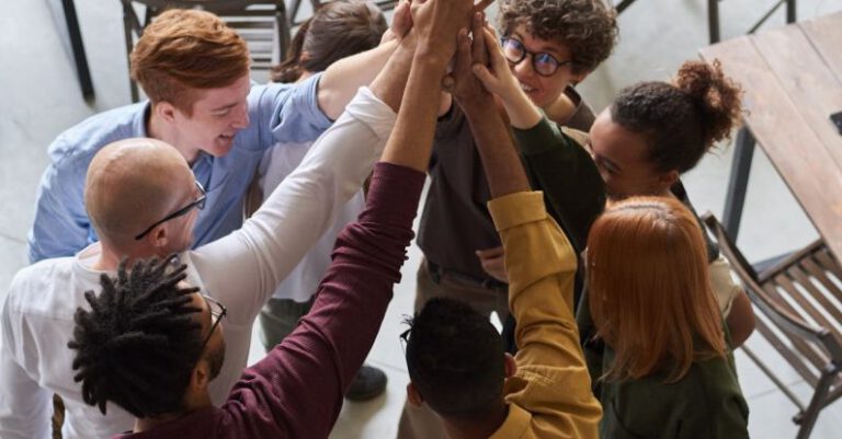 Company Culture - Photo Of People Holding Each Other's Hands