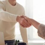 Negotiation Techniques - Man and Woman Near Table