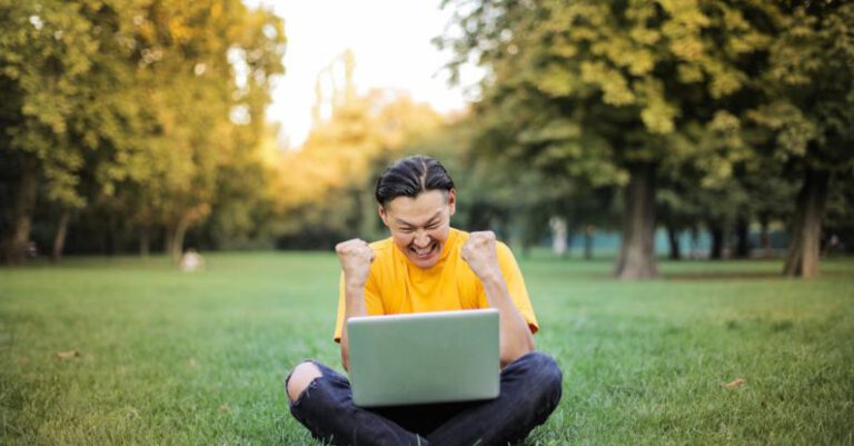 Win-Win Approach - Man Sitting on a Green Grass Field