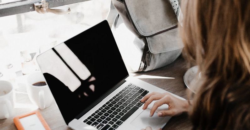 Project Casebook - Close-up Photography of Woman Sitting Beside Table While Using Macbook